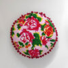 cojín redondo folklore rosa