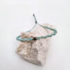 pulsera estrella mint, hecha a mano con poliéster encerado y una pieza central con forma de estrella y baño de oro.